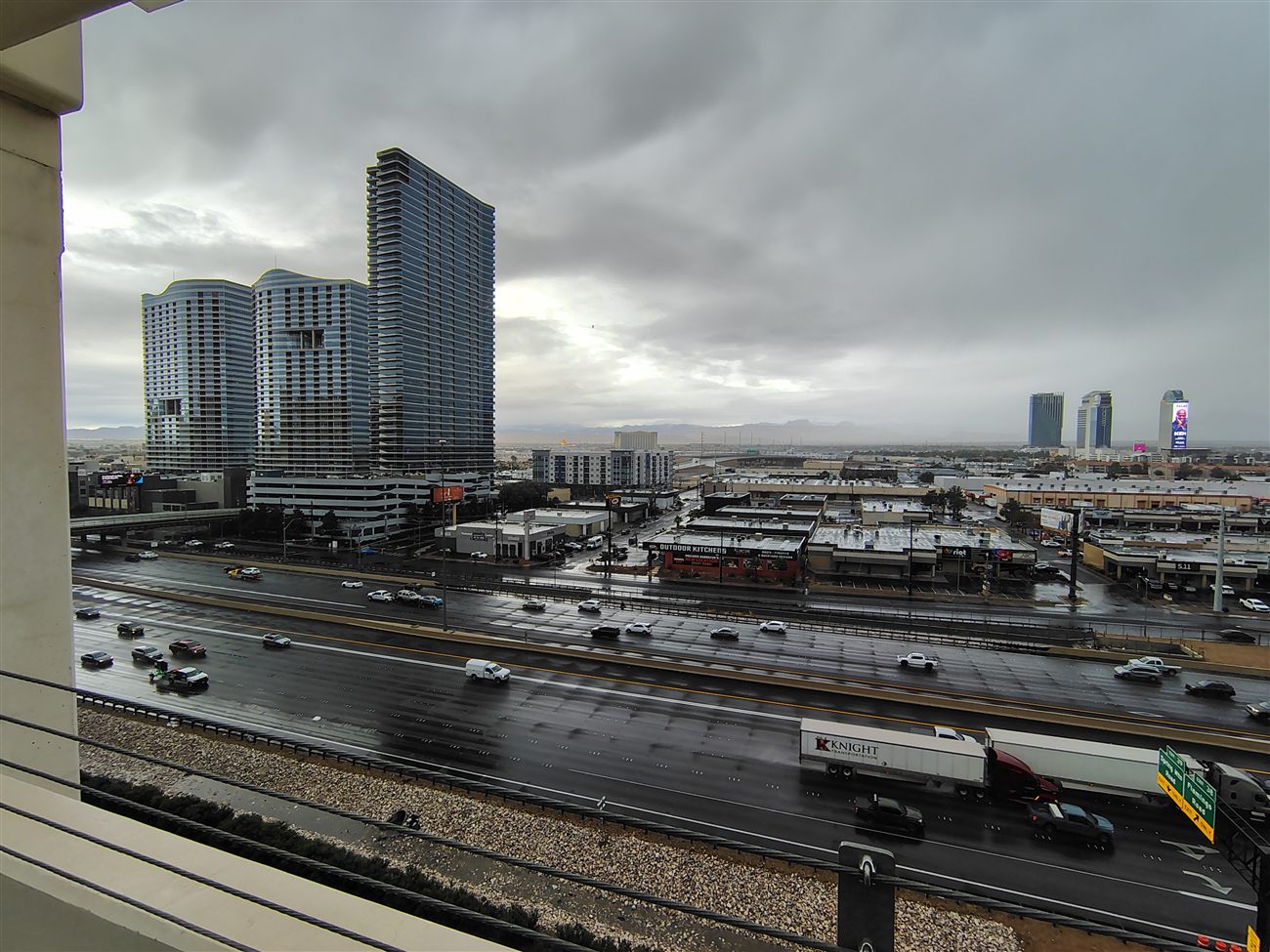 Rainy overcast highway view of Las Vegas with a semi truck
