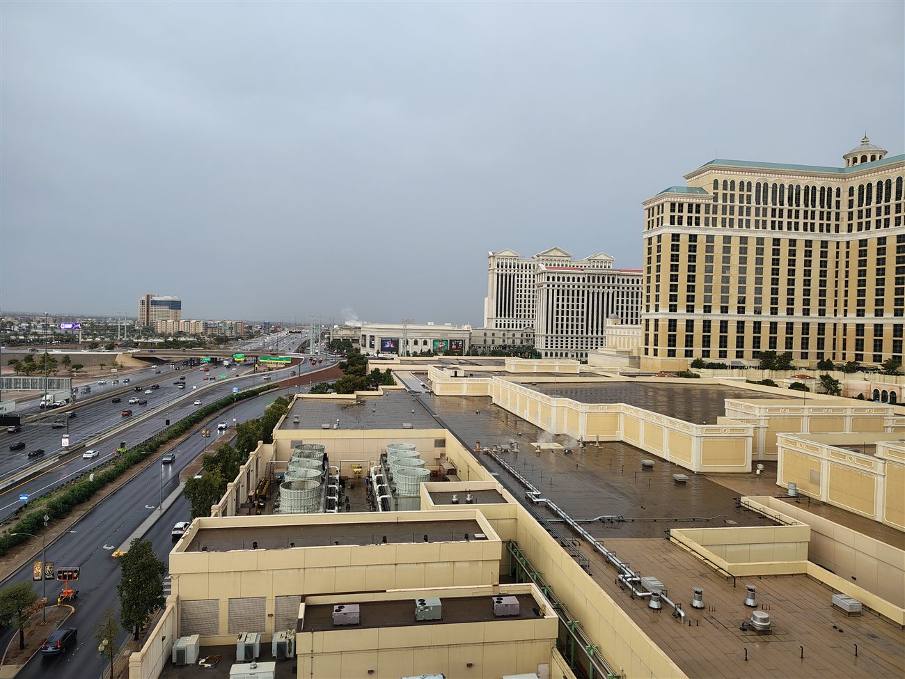 Rooftop view of Caesars Palace and the Bellagio pool deck in the rain