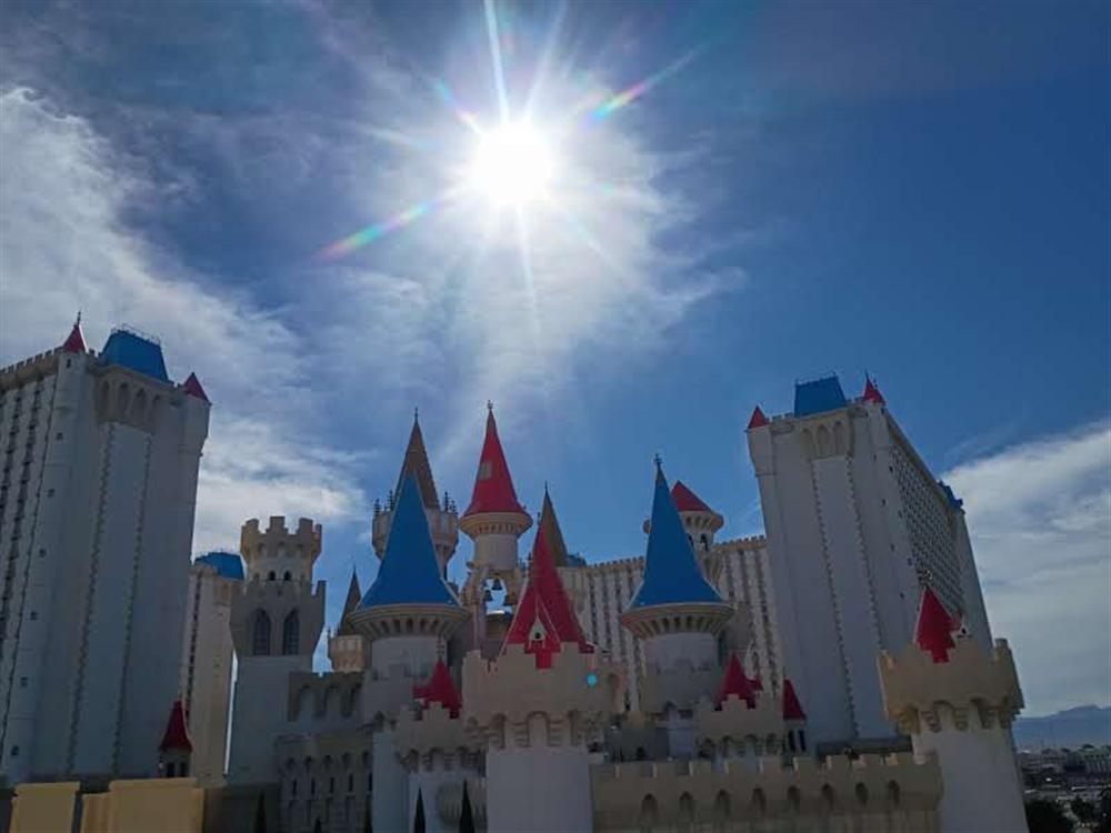 The Excalibur castle turrets backlit by sun flare