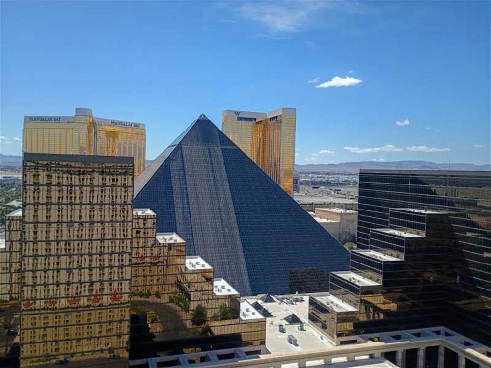 The Luxor pyramid with reflections of nearby towers in its glass
