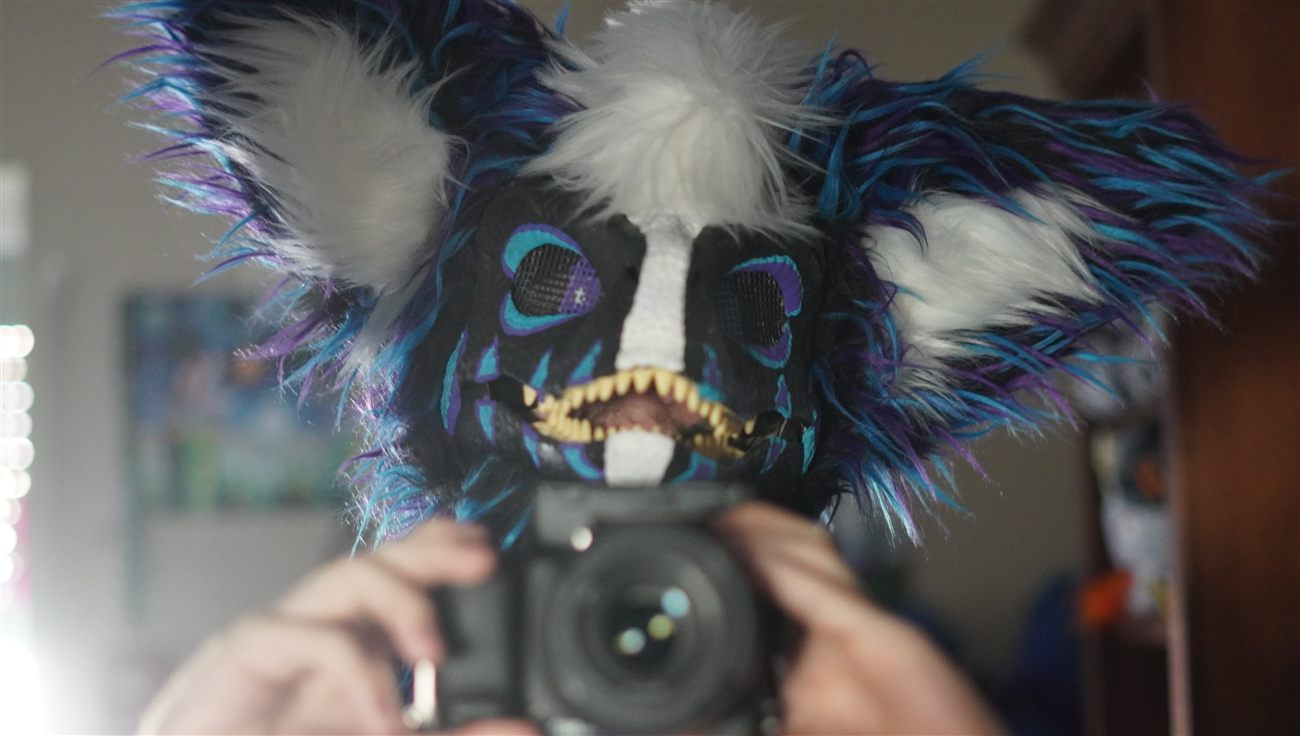 A blue and purple furred dino fursuit head
