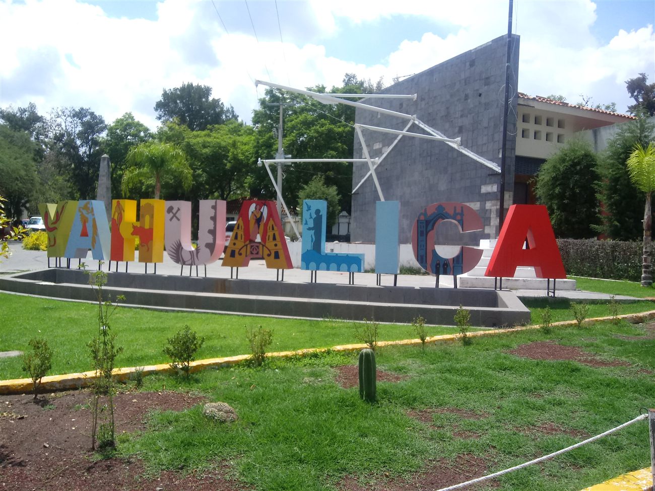 A colorful sign reading Yahualica marking the town